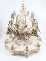 A large Chinese composite table centrepiece in the form of a globe surmounted by a seated scholar