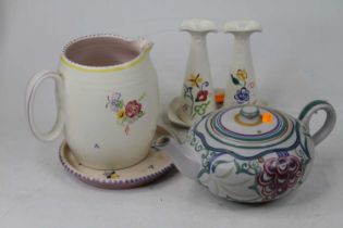 A collection of Poole pottery, to include a Carter Stabler & Adams teapot and a water jug (4)