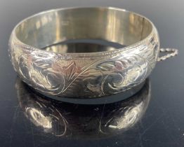 A Victorian style silver and engraved hinge bangle, 7cm