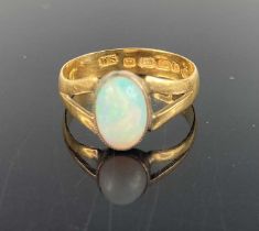 A 22ct gold and cabochon opal set ring (appears to be converted from wedding band) 2.9g, size O