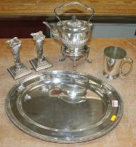 An early 20th century silver plated spirit kettle, of half-gadrooned oval form, with burner below;