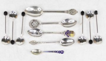 A continental white metal salt spoon, the stem enamel decorated with flower heads; together with a