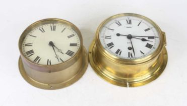 A Sestrel brass cased ship's bulkhead clock having a circular enamel dial with Roman numerals and