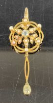 An Edwardian 15ct yellow gold blue topaz and seed pearl set openwork pendant, 4.9g, dia. 21mm