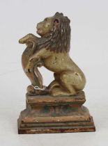 A painted cast iron doorstop in the form of a lion, h.20cm