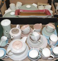 Two boxes of miscellaneous two-tone Poole Pottery tablewares, to include teacups and saucers, coffee