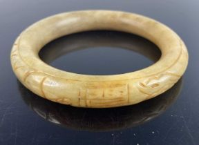 A Chinese carved nephrite bangle