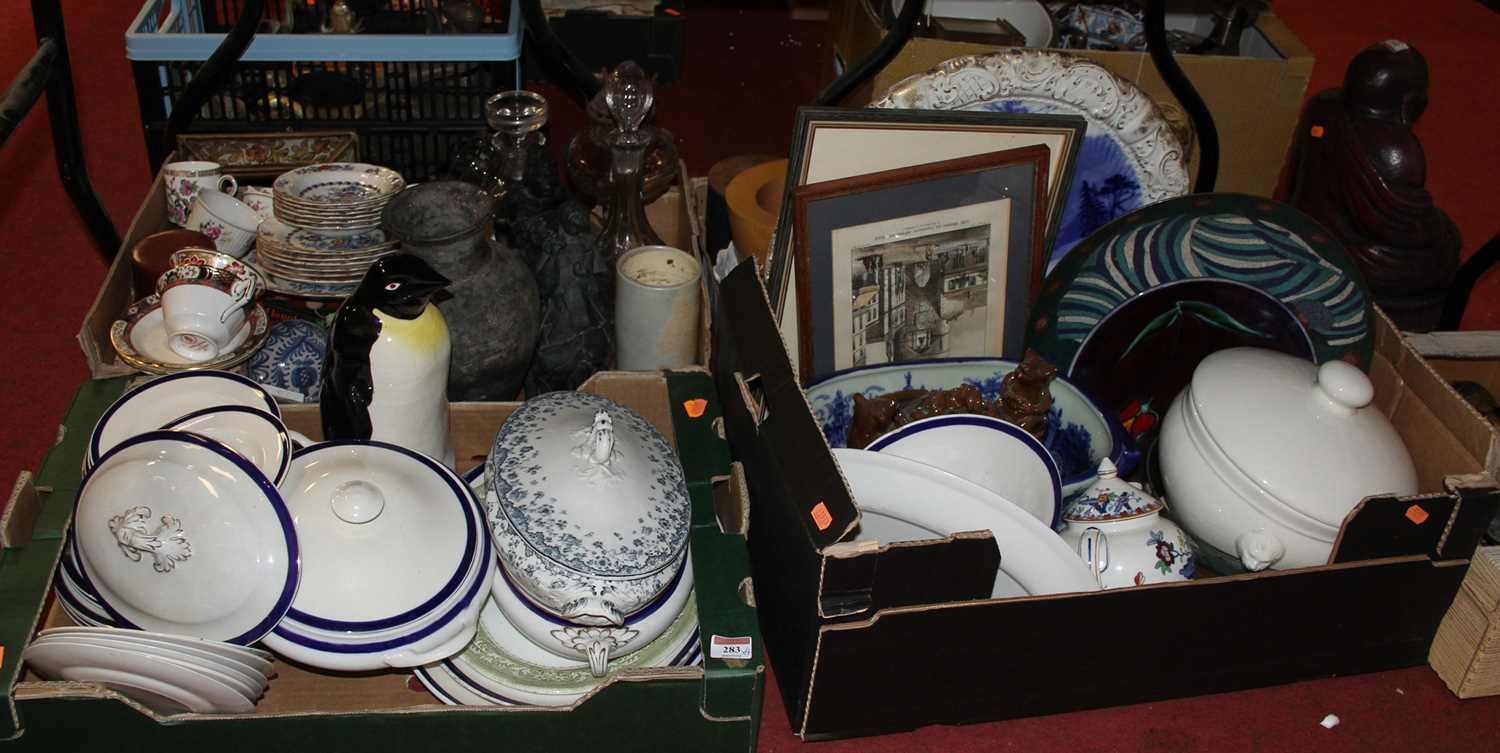 Four boxes of ceramics and glassware to include glazed pottery moneybank in the form of a penguin,