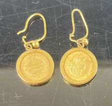 A pair of yellow metal ear pendants, each containing 1853 US $1 gold coin on shepherd's crook