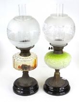 A Victorian oil lamp having a clear glass chimney and etched, frosted and clear glass shade to