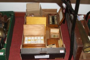 A late 19th/early 20th century pine case containing various trays of microscopic slides, many with