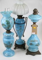 A late 19th century oil lamp having a clear glass chimney, opaline glass shade, to Hinks No. 2
