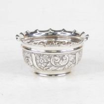 An Edwardian silver sugar bowl, having a shaped rim and floral C-scrolling repousse decoration, 2.