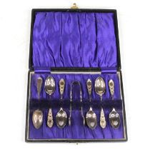 A set of six George V silver teaspoons and sugar nips, cased, 2.6ozt