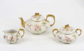 A French porcelain floral painted parcel gilt part tea service comprising teapot, height 12cm,