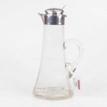 An Edwardian claret jug, having a clear conical glass body with silver mount, repousse decorated