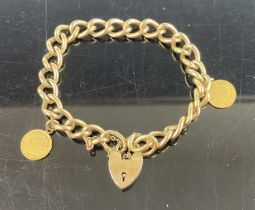 A rolled gold curb link bracelet with heart shaped padlock clasp, containing two gold American $1