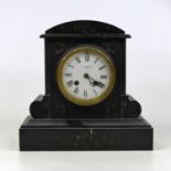 A Victorian black slate cased mantel clock, of architectural form, having an enamelled dial with