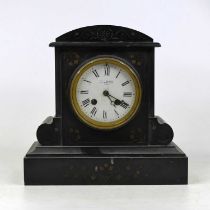 A Victorian black slate cased mantel clock, of architectural form, having an enamelled dial with