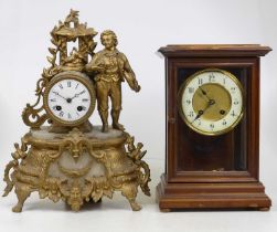 A Victorian glazed walnut cased mantel clock, having an enamelled chapter ring with Roman numerals