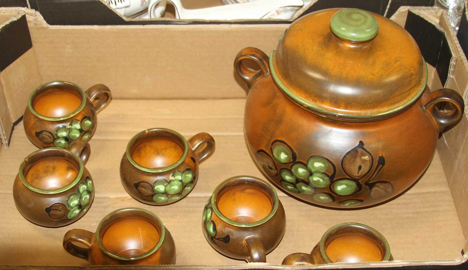 A mid 20th century West German Waechtersbach soup tureen and cover on a brown ground painted with