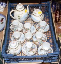 A Japanese eggshell porcelain eight place setting tea service, enamel decorated with figures and