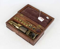 A 19th century lacquered brass student's monocular microscope of typical cylindrical form with