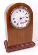 An Edwardian mahogany and pearwood strung dome top mantel clock, the painted dial with Roman