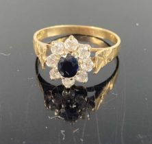 A modern 9ct gold and CZ set flower head cluster ring, setting dia. 10.8mm, 2.2g, size N