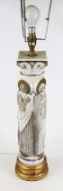 A porcelain column shaped table lamp in the form of four saints, surmounted by corinthian capital on