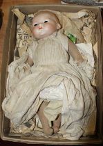 An early 20th century Armand Marseilles bisque head doll, impressed to the neck AM Germany 34718,