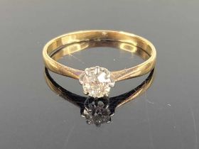 An 18ct gold diamond solitaire ring, the eight claw set round cut diamond weighing approx 0.25ct,