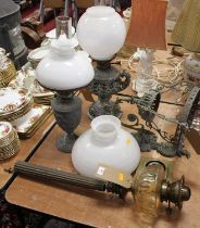 An early 20th century oil lamp having Messenger patent bayonet fit burner and clear glass