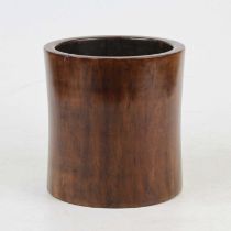 A Chinese stained bamboo brush pot of typical cylindrical shape with remains of gilt painted