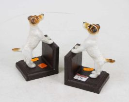 A pair of novelty painted cast iron book ends in the form of terriers, height 15cm These are brand