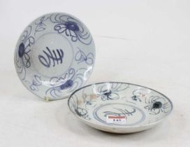 A Chinese blue and white dish underglaze decorated with flowers, dia. 18cm, together with another