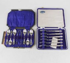 A set of six pastry forks, each having steel prongs and sterling silver clad handles, in fitted