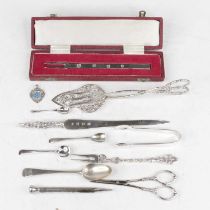 A collection of silver and continental white metal items, to include a letter-opener, cake slice,