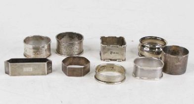 A collection of nine silver napkin rings, various dates and makers, 5.5oz