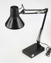 A black painted anglepoise style desk lamp, on a weighted rectangular base, height fully extended