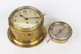 A Smiths lacquered brass cased ship's bulkhead clock, having a signed enamel dial with Arabic