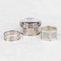 A modern silver trinket jar, the domed cover beaded rim; together with two silver napkin rings,