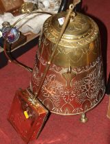 An early 20th century brass and copper Dutch ash bucket of conical form, embossed with a crown and