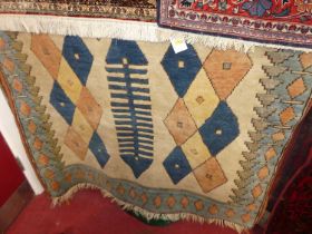 A caucasian woollen cream ground rug, with all over stylised geometric motifs, approx 210 x 125cm