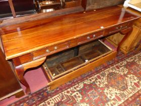 A contemporary hardwood three drawer long hall table on cabriole supports, width 178cm