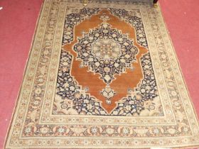 A Persian woollen sarouk rug, having trailing borders, 178 x 129cm Colours are slightly muted.Some