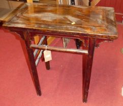 An Oriental stained hardwood side table, raised on plain turned supports united by stretchers, width