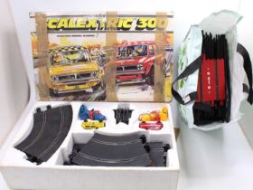 A boxed Scalextric Model Racing Set No. 300 together with a selection of spare track