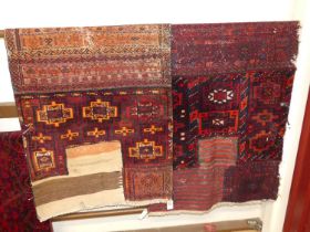 Two near matching Persian woollen kilim hall rugs, each red ground with typical geometric
