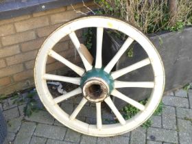 An early 20th century painted wood and iron bound wagon wheel, dia.72cm